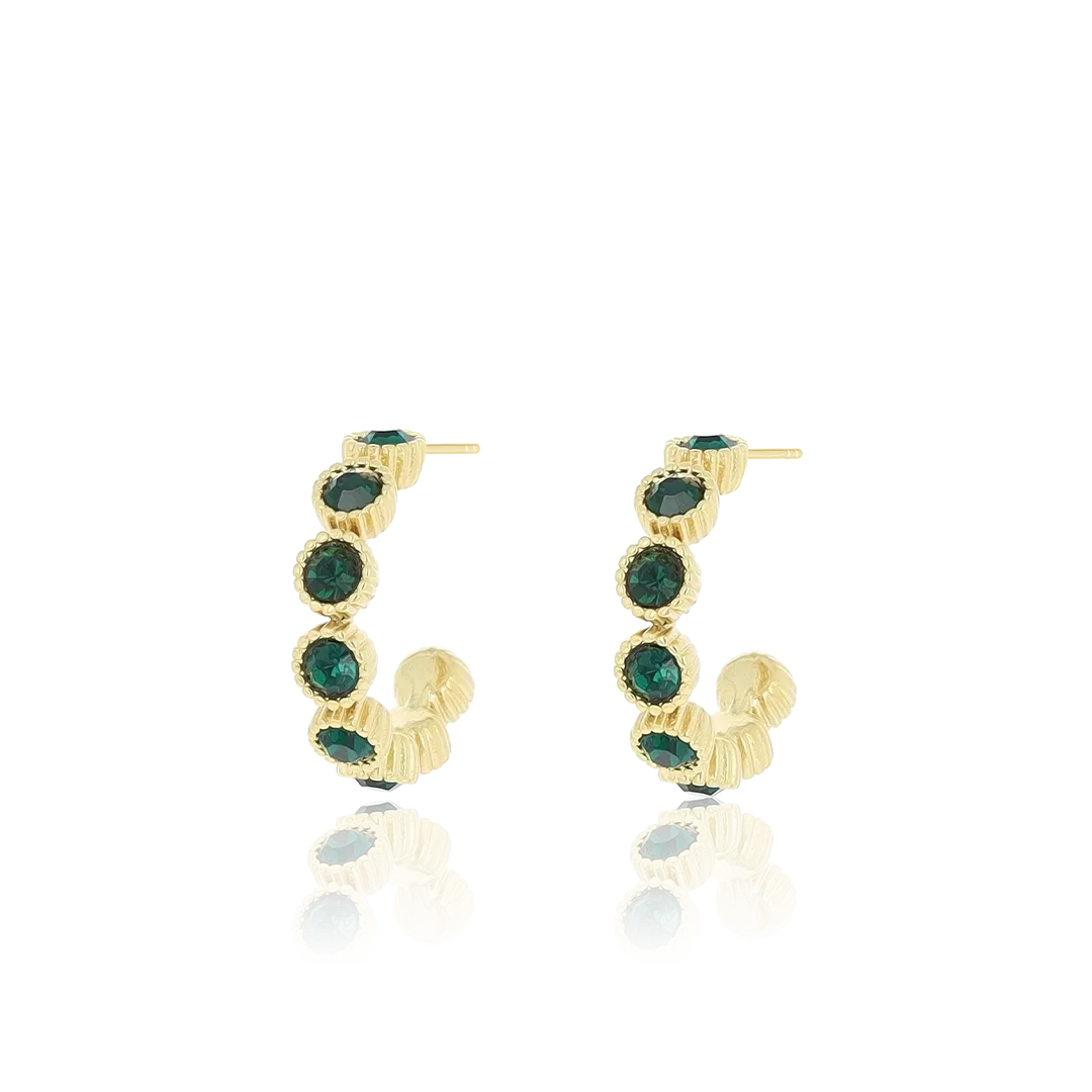 Gold coloured earrings with green stones